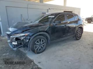 ✅ 2018 Mazda CX-5 Touring • VIN: JM3KFBCM6J0306985 • Lot: 91616465. Listed on Copart with 106,570 mi. Free auction sales archive from the USA and detailed vehicle history report at DreamBid. Image 1.