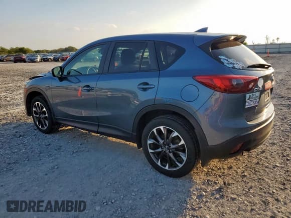 ✅ 2016 Mazda CX-5 Grand Touring • VIN: JM3KE2DY3G0703048 • Lot: 85378725. Wystawiony na Copart z przebiegiem 28 667 mil. Bezpłatny archiwum sprzedaży aukcyjnych z USA i szczegółowy raport historii pojazdu na DreamBid. Zdjęcie 2.
