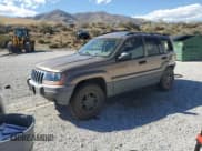 ✅ 2002 Jeep Grand Cherokee Laredo • VIN: 1J4GW48S52C232227 • Lot: 85100645. Listed on Copart with 128,563 mi. Free auction sales archive from the USA and detailed vehicle history report at DreamBid. Image 1.