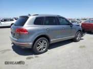 ✅ 2016 Volkswagen Touareg Sport • VIN: WVGEP9BP5GD003605 • Lot: 57679965. Listed on Copart with 171,786 mi. Free auction sales archive from the USA and detailed vehicle history report at DreamBid. Image 3.