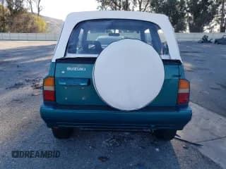 ✅ 1995 Suzuki Sidekick • VIN: 2S3TA02C3S6414337 • Lot: 86304134. Listed on Copart with 104,889 mi. Free auction sales archive from the USA and detailed vehicle history report at DreamBid. Image 6.