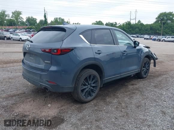 ✅ 2023 Mazda CX-5 S Carbon Edition • VIN: JM3KFBCM4P0142175 • Lot: 42523647. Listed on IAAI with 48,655 mi. Free auction sales archive from the USA and detailed vehicle history report at DreamBid. Image 4.