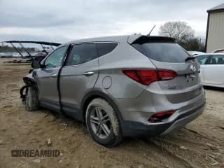 ✅ 2018 Hyundai Santa Fe 2.4L • VIN: 5NMZT3LB5JH079406 • Лот: 41258653. Опубликован ранее на Copart с пробегом 102 501 миль. Бесплатный доступ к архиву аукционных продаж из США и подробный отчёт об истории автомобиля на DreamBid. Изображение 2.