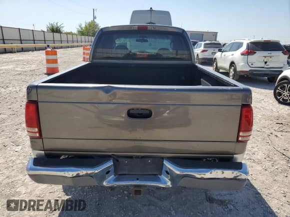 2001 Dodge Dakota Sport z VIN 1B7HL2AN61S301927, wystawiony jako Copart lot #74676094 z przebiegiem 228 616 mil mil oraz Szkoda całkowita • Salvage title. Historia ofert i sprzedaży dostępna na DreamBid. Obrazek 6.