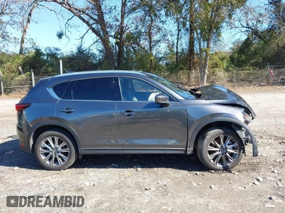 ✅ 2021 Mazda CX-5 Signature • VIN: JM3KFBEY6M0449522 • Lot: 43605201. Listed on IAAI with 15,080 mi. Free auction sales archive from the USA and detailed vehicle history report at DreamBid. Image 13.