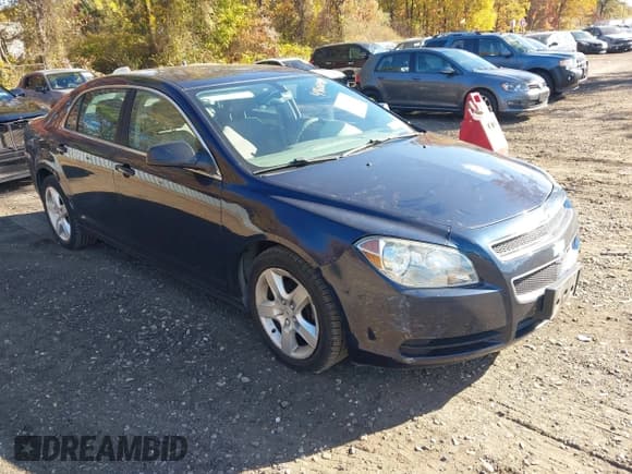 ✅ 2011 Chevrolet Malibu 1LS • VIN: 1G1ZB5E12BF174306 • Lot: 43606198. Listed on IAAI with 107,511 mi. Free auction sales archive from the USA and detailed vehicle history report at DreamBid. Image 1.