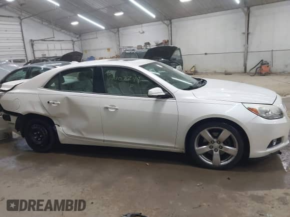 2013 Chevrolet Malibu LTZ with VIN 1G11J5SX2DF190629, listed as a IAAI auction lot 42402298 with 69,042 mi miles and . Bid and sale history available at DreamBid. Image 14.