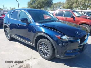 ✅ 2020 Mazda CX-5 Touring • VIN: JM3KFACM1L0788889 • Lot: 43565335. Wystawiony na IAAI z przebiegiem 80 155 mil. Bezpłatny archiwum sprzedaży aukcyjnych z USA i szczegółowy raport historii pojazdu na DreamBid. Zdjęcie 1.