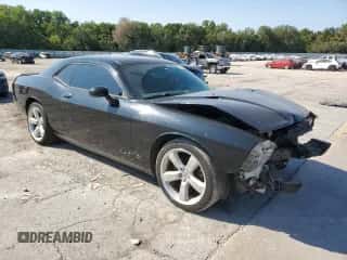 2012 Dodge Challenger SXT z VIN 2C3CDYAG4CH118276, wystawiony jako Copart lot #70877304 z przebiegiem 118 691 mil mil oraz Szkoda całkowita • Salvage title. Historia ofert i sprzedaży dostępna na DreamBid. Obrazek 4.