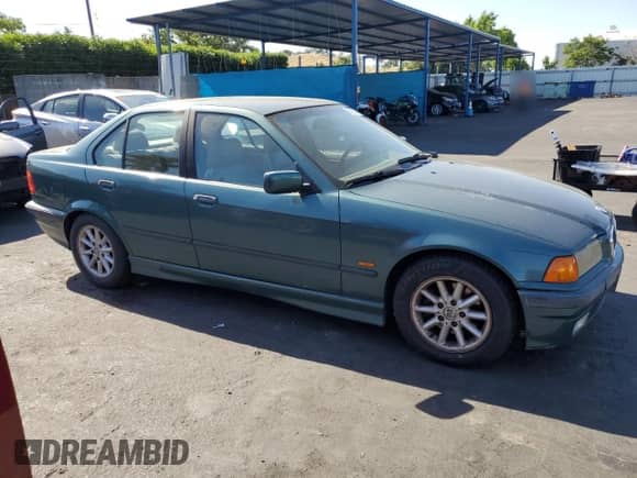 1998 BMW 3 Series 328i with VIN WBACD4327WAV59714, listed as a Copart auction lot 56232735 with 169,484 mi miles and Clean title. Bid and sale history available at DreamBid. Image 4.