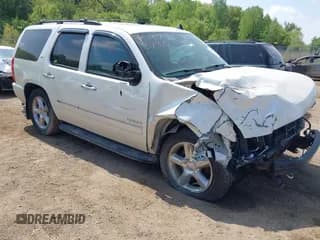 ✅ 2014 Chevrolet Tahoe LTZ • VIN: 1GNSKCE00ER248482 • Lot: 42276740. Listed on IAAI with 158,454 mi. Free auction sales archive from the USA and detailed vehicle history report at DreamBid. Image 1.