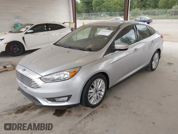✅ 2017 Ford Focus Titanium • VIN: 1FADP3J29HL329410 • Lot: 42493519. Listed on IAAI with 22,639 mi. Free auction sales archive from the USA and detailed vehicle history report at DreamBid. Image 2.