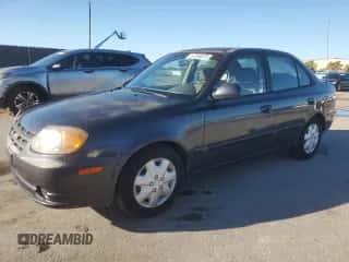 2005 Hyundai Accent GLS z VIN KMHCG45C05U665091, wystawiony jako Copart lot #87264075 z przebiegiem 179 141 mil mil oraz Szkoda całkowita • Salvage title. Historia ofert i sprzedaży dostępna na DreamBid. Obrazek 1.