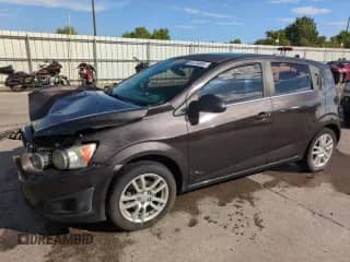 2015 Chevrolet Sonic LT with VIN 1G1JC6SB1F4148066, listed as a Copart auction lot 64134855 with 107,831 mi miles and Salvage title. Bid and sale history available at DreamBid. Image 1.