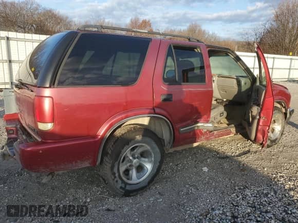 2000 Chevrolet Blazer LT z VIN 1GNCS13W0Y2279860, wystawiony jako Copart lot #85297234 z przebiegiem 192 927 mil mil oraz Szkoda całkowita • Salvage title. Historia ofert i sprzedaży dostępna na DreamBid. Obrazek 3.