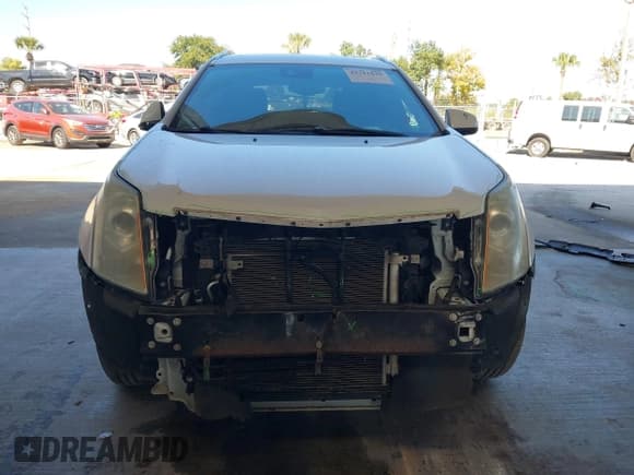 ✅ 2016 Cadillac SRX Performance Collection • VIN: 3GYFNCE30GS565930 • Lot: 43711639. Listed on IAAI with 112,092 mi. Free auction sales archive from the USA and detailed vehicle history report at DreamBid. Image 13.