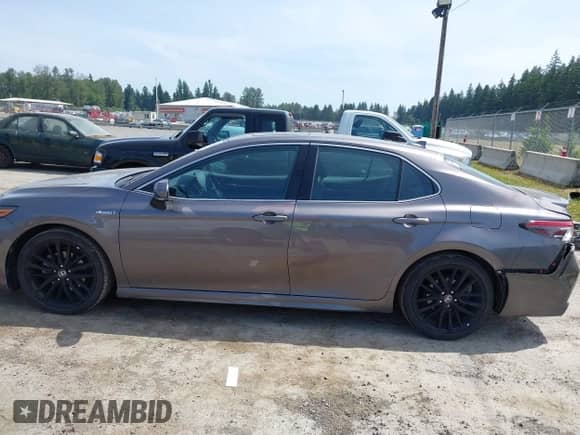 2021 Toyota Camry Hybrid XSE with VIN 4T1K31AK2MU559887, listed as a IAAI auction lot 42487632 with 24,069 mi miles and . Bid and sale history available at DreamBid. Image 14.