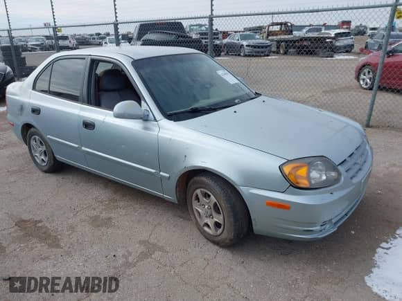 2005 Hyundai Accent GLS z VIN KMHCG45C65U576092, wystawiony jako IAAI lot #41368504 z przebiegiem 162 208 mil mil oraz . Historia ofert i sprzedaży dostępna na DreamBid. Obrazek 1.