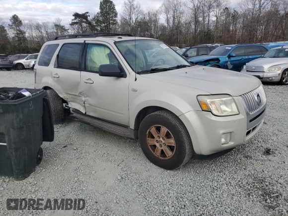 2009 Mercury Mariner with VIN 4M2CU81759KJ04555, listed as a Copart auction lot 85778504 with 130,514 mi miles and Salvage title. Bid and sale history available at DreamBid. Image 4.