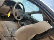 ✅ 1998 Ford Escort • VIN: 3FALP1138WR126709 • Лот: 69271634. Опубликован ранее на Copart с пробегом 234 137 миль. Бесплатный доступ к архиву аукционных продаж из США и подробный отчёт об истории автомобиля на DreamBid. Изображение 8.