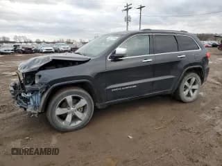 ✅ 2015 Jeep Grand Cherokee Overland • VIN: 1C4RJFCM4FC706109 • Lot: 81279744. Listed on Copart with 160,295 mi. Free auction sales archive from the USA and detailed vehicle history report at DreamBid. Image 1.