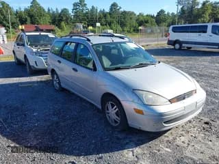 ✅ 2001 Ford Focus SE • VIN: 1FAFP363X1W159914 • Lot: 43123842. Listed on IAAI with 166,160 mi. Free auction sales archive from the USA and detailed vehicle history report at DreamBid. Image 1.