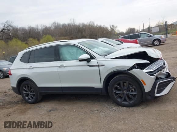 ✅ 2023 Volkswagen Tiguan SE • VIN: 3VVNB7AX4PM100180 • Lot: 42062208. Listed on IAAI with 12,922 mi. Free auction sales archive from the USA and detailed vehicle history report at DreamBid. Image 13.