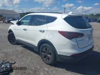 2016 Hyundai Santa Fe z VIN 5XYZUDLB2GG368085, wystawiony jako IAAI lot #43321413 z przebiegiem 168 280 mil mil oraz . Historia ofert i sprzedaży dostępna na DreamBid. Obrazek 3.