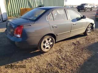 2003 Hyundai Elantra GLS z VIN KMHDN45D83U598594, wystawiony jako Copart lot #76713594 z przebiegiem 138 884 mil mil oraz Szkoda całkowita • Salvage title. Historia ofert i sprzedaży dostępna na DreamBid. Obrazek 3.