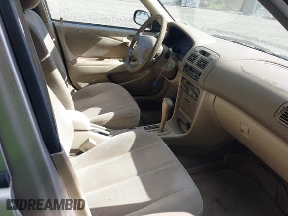 ✅ 1999 Toyota Corolla VE • VIN: 2T1BR12E1XC141396 • Lot: 42969365. Listed on IAAI with 215,831 mi. Free auction sales archive from the USA and detailed vehicle history report at DreamBid. Image 5.