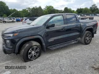 ✅ 2023 GMC Canyon 4WD AT4 • VIN: 1GTP6DEK5P1266181 • Лот: 60084855. Опубликован ранее на Copart с пробегом 11 737 миль. Бесплатный доступ к архиву аукционных продаж из США и подробный отчёт об истории автомобиля на DreamBid. Изображение 1.