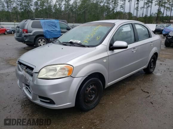 2007 Chevrolet Aveo LS z VIN KL1TD56647B124787, wystawiony jako Copart lot #44301344 z przebiegiem Nie podano mil oraz Szkoda całkowita • Salvage title. Historia ofert i sprzedaży dostępna na DreamBid. Obrazek 1.
