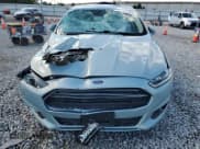 ✅ 2013 Ford Fusion SE Hybrid • VIN: 3FA6P0LU4DR368875 • Lot: 82259635. Wystawiony na Copart z przebiegiem 103 163 mil. Bezpłatny archiwum sprzedaży aukcyjnych z USA i szczegółowy raport historii pojazdu na DreamBid. Zdjęcie 5.