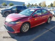 ✅ 2021 Toyota Camry LE • VIN: 4T1C11AK2MU601887 • Lot: 43711630. Listed on IAAI with 31,597 mi. Free auction sales archive from the USA and detailed vehicle history report at DreamBid. Image 2.