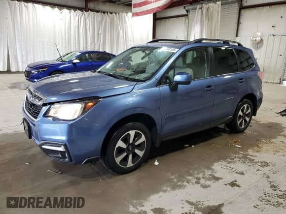 2017 Subaru Forester Limited with VIN JF2SJAJC5HH527843, listed as a Copart auction lot 82440135 with 64,197 mi miles and Salvage title. Bid and sale history available at DreamBid. Image 1.
