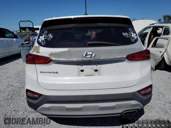 2019 Hyundai Santa Fe SE с VIN 5NMS23AD0KH001903, выставлен на аукционе Copart как лот 91165425 с пробегом 69 358 миль миль и Списание • Salvage title. История ставок и продаж доступна на DreamBid. Изображение 6.
