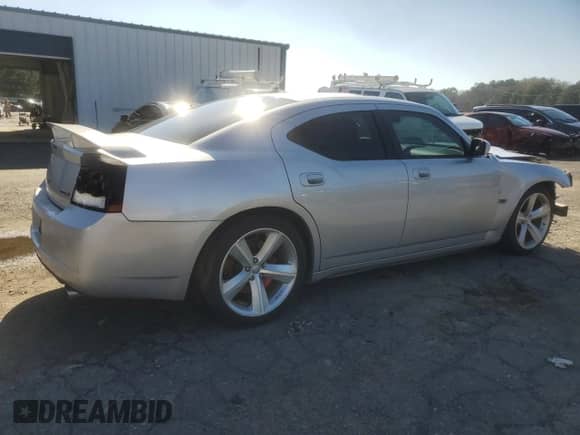 2009 Dodge Charger SRT-8 с VIN 2B3LA73W09H610039, выставлен на аукционе Copart как лот 86885314 с пробегом Не указан миль и Списание • Salvage title. История ставок и продаж доступна на DreamBid. Изображение 3.