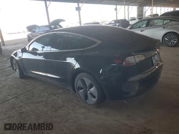 ✅ 2020 Tesla Model 3 Standard Range Plus • VIN: 5YJ3E1EA9LF630112 • Лот: 84725415. Опубликован ранее на Copart с пробегом 54 026 миль. Бесплатный доступ к архиву аукционных продаж из США и подробный отчёт об истории автомобиля на DreamBid. Изображение 2.