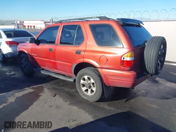 ✅ 1999 Isuzu Rodeo S • VIN: 4S2CK58W3X4307201 • Lot: 41884901. Listed on IAAI with 236,970 mi. Free auction sales archive from the USA and detailed vehicle history report at DreamBid. Image 3.