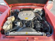 ✅ 1986 Mercedes-Benz SL • VIN: WDB1070461A036937 • Лот: 77156424. Опубликован ранее на Copart с пробегом 56 187 миль. Бесплатный доступ к архиву аукционных продаж из США и подробный отчёт об истории автомобиля на DreamBid. Изображение 11.