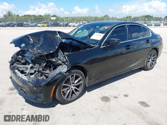 ✅ 2021 BMW 3 Series 330e • VIN: 3MW5P7J03M8B77532 • Lot: 43021005. Listed on IAAI with 59,787 mi. Free auction sales archive from the USA and detailed vehicle history report at DreamBid. Image 2.