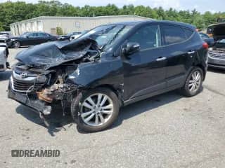 2012 Hyundai Tucson Limited with VIN KM8JUCAC3CU373044, listed as a Copart auction lot 63332365 with 147,868 mi miles and Salvage title. Bid and sale history available at DreamBid. Image 1.