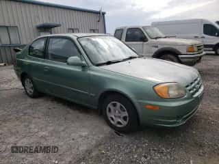 2005 Hyundai Accent GLS z VIN KMHCG35C05U325871, wystawiony jako Copart lot #64258985 z przebiegiem 166 574 mil mil oraz Szkoda całkowita • Salvage title. Historia ofert i sprzedaży dostępna na DreamBid. Obrazek 4.