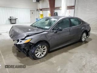 2023 Toyota Camry LE с VIN 4T1C11BK7PU097260, выставлен на аукционе Copart как лот 67957575 с пробегом 21 092 миль миль и Списание • Salvage title. История ставок и продаж доступна на DreamBid. Изображение 1.