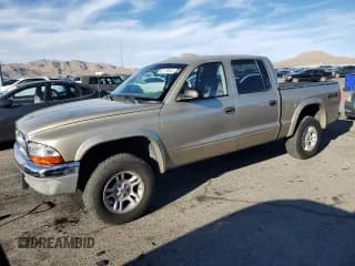 ✅ 2003 Dodge Dakota SLT • VIN: 1D7HG48N43S239393 • Lot: 82178244. Wystawiony na Copart z przebiegiem 246 860 mil. Bezpłatny archiwum sprzedaży aukcyjnych z USA i szczegółowy raport historii pojazdu na DreamBid. Zdjęcie 1.
