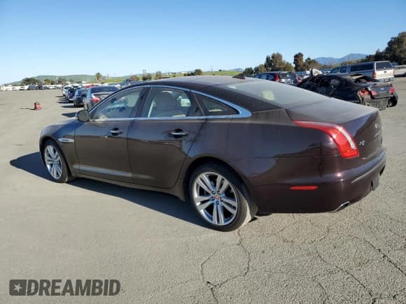 ✅ 2014 Jaguar XJ • VIN: SAJWA1CZ3E8V69877 • Лот: 48159005. Опубликован ранее на Copart с пробегом 57 567 миль. Бесплатный доступ к архиву аукционных продаж из США и подробный отчёт об истории автомобиля на DreamBid. Изображение 2.