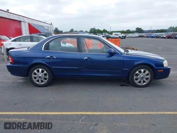 ✅ 2005 Kia Optima LX • VIN: KNAGD128455390068 • Lot: 42466140. Listed on IAAI with 128,832 mi. Free auction sales archive from the USA and detailed vehicle history report at DreamBid. Image 13.