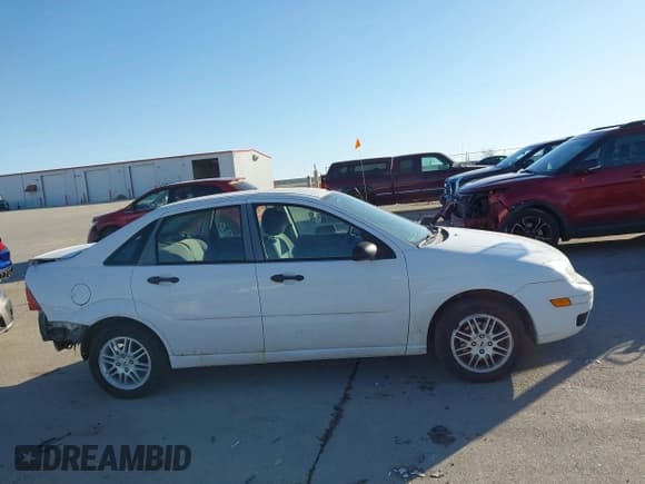 ✅ 2007 Ford Focus S • VIN: 1FAFP34N77W263497 • Lot: 43660448. Listed on IAAI with 121,965 mi. Free auction sales archive from the USA and detailed vehicle history report at DreamBid. Image 14.