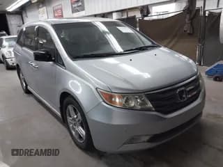 ✅ 2012 Honda Odyssey Touring • VIN: 5FNRL5H90CB004537 • Lot: 43184321. Listed on IAAI with 132,469 mi. Free auction sales archive from the USA and detailed vehicle history report at DreamBid. Image 1.