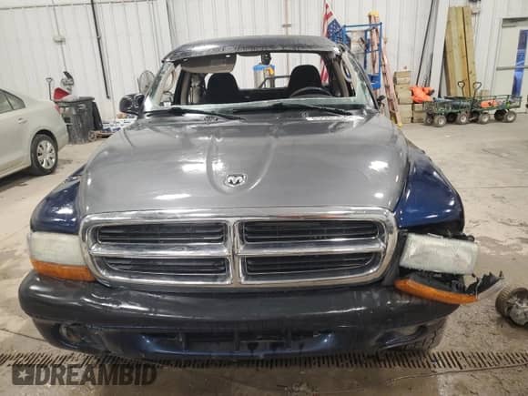 2003 Dodge Dakota Sport z VIN 1D7HG32N43S328884, wystawiony jako Copart lot #85985644 z przebiegiem 141 779 mil mil oraz Nie do naprawy • Non repairable. Historia ofert i sprzedaży dostępna na DreamBid. Obrazek 5.